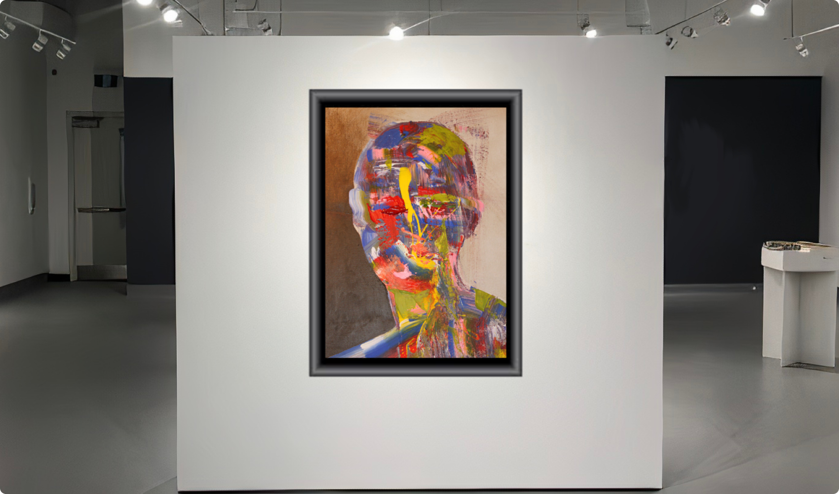 Painting framed on a white wall in a studio room